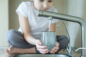 A child and tap water. The first step in a Legionella risk assessment is to identify the hazards within your system