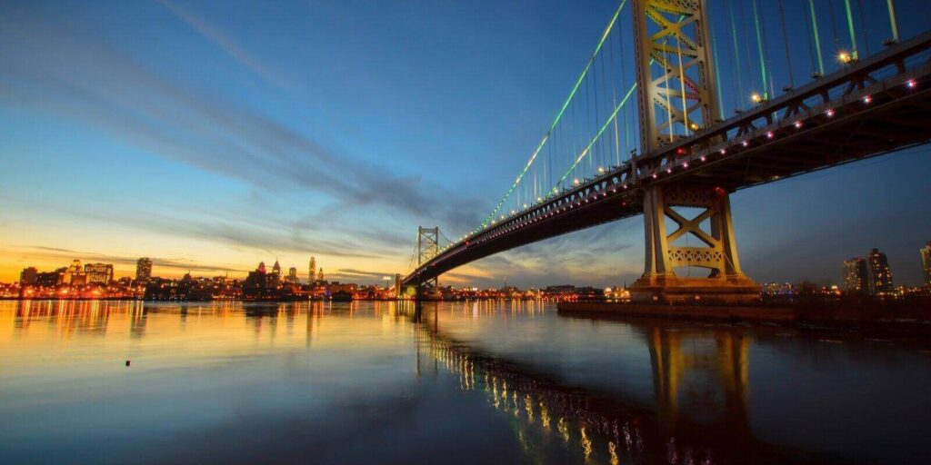 benjamin franklin bridge after sunset from new jersey side
