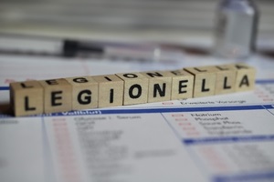 closeup of word legionella on laboratory requisition slip