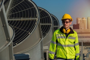 confident supervisor on cooling tower