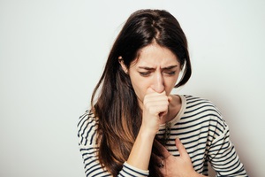 woman coughing knowing how do you catch legionnaires disease