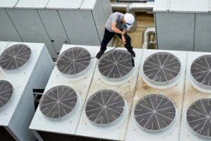 technician cleaning cooling tower