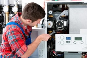 expert inspecting water boiler system