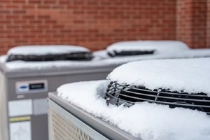 hvac covered in snow