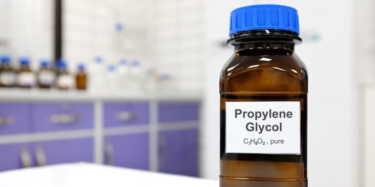 propylene glycol liquid chemical compound in dark glass bottle inside a chemistry laboratory with copy space