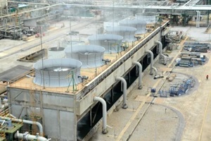 cooling tower and cooling fan blowing steam on the air in chemical plant