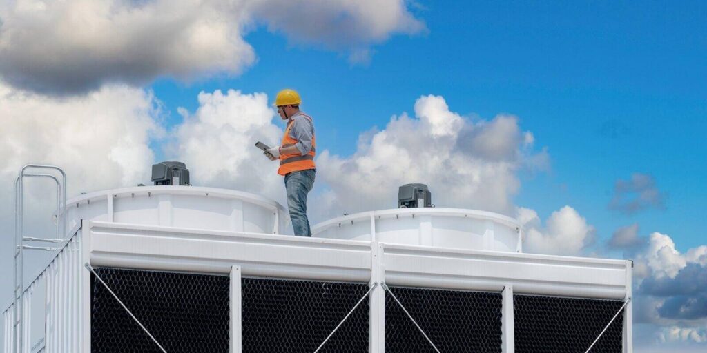 engineer under checking the industry cooling tower air conditioner is water cooling tower air chiller hvac