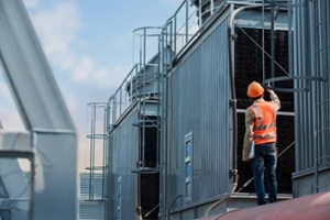 engineer inspecting the cooling tower units